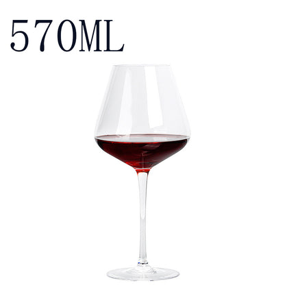 Wine glass with red wine and '570ML' text on a white background