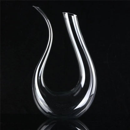 Clear glass decanter on a black background