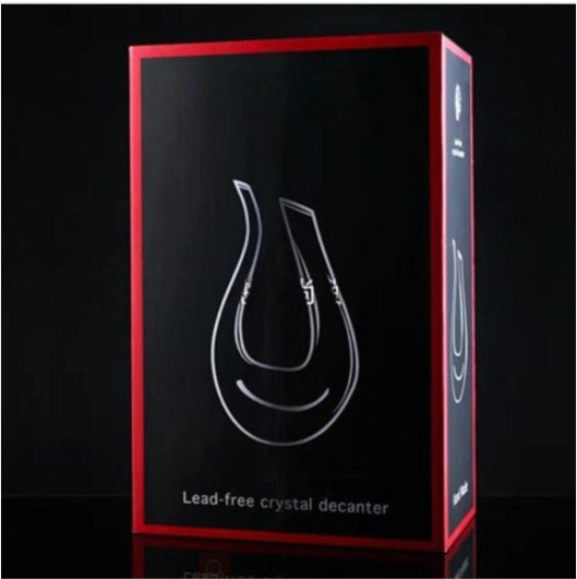 Box packaging of a lead-free crystal decanter with red border on black background