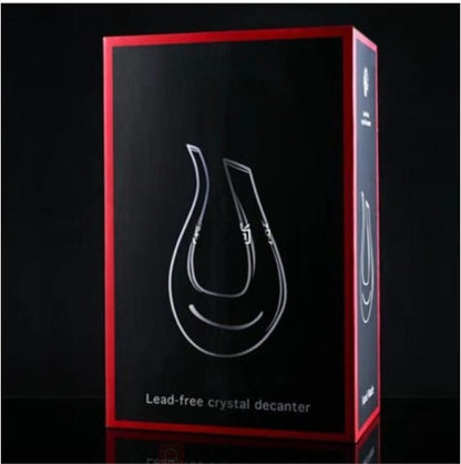 Box packaging of a lead-free crystal decanter with red border on black background
