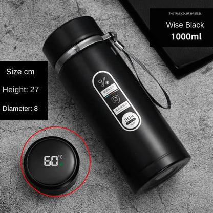 Black thermos bottle with digital temperature display on a gray surface