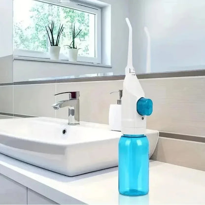 Blue nasal irrigation device on a bathroom counter with a sink and window in the background.