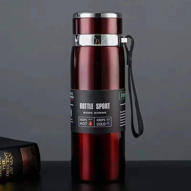 Red thermos bottle with a black label on a dark surface