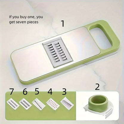 Green kitchen tool with multiple attachments on a light background