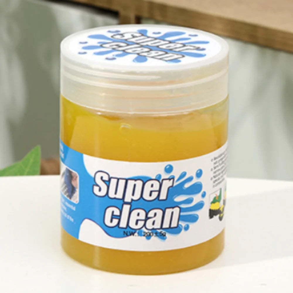 Jar of 'Super Clean' product on a white surface with a blurred background