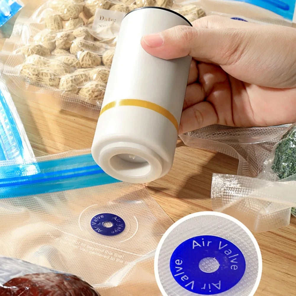 Hand holding a white air valve with a close-up of the valve label on a wooden surface with food packaging.
