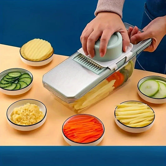 Person using a mandoline slicer to slice vegetables on a table with sliced vegetables in bowls.