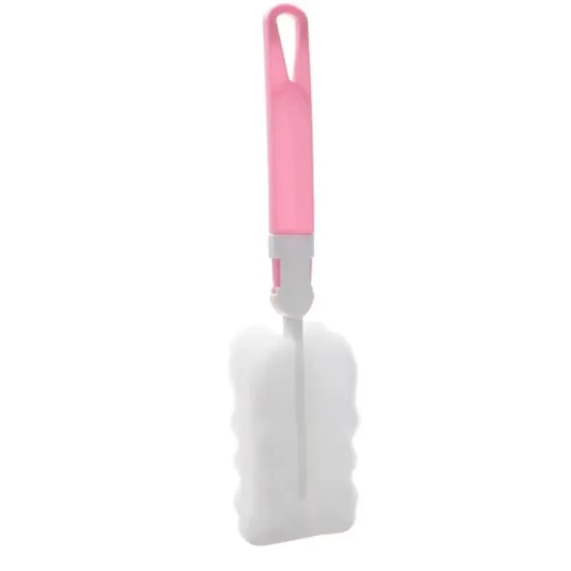 Cleaning brush with pink handle on a white background