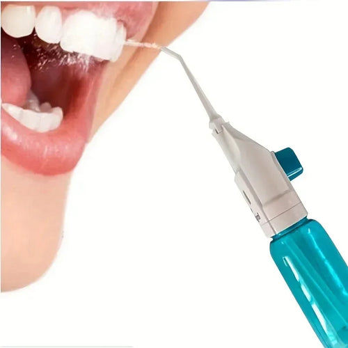 Teeth cleaning tool being used on a person's teeth with a close-up view.