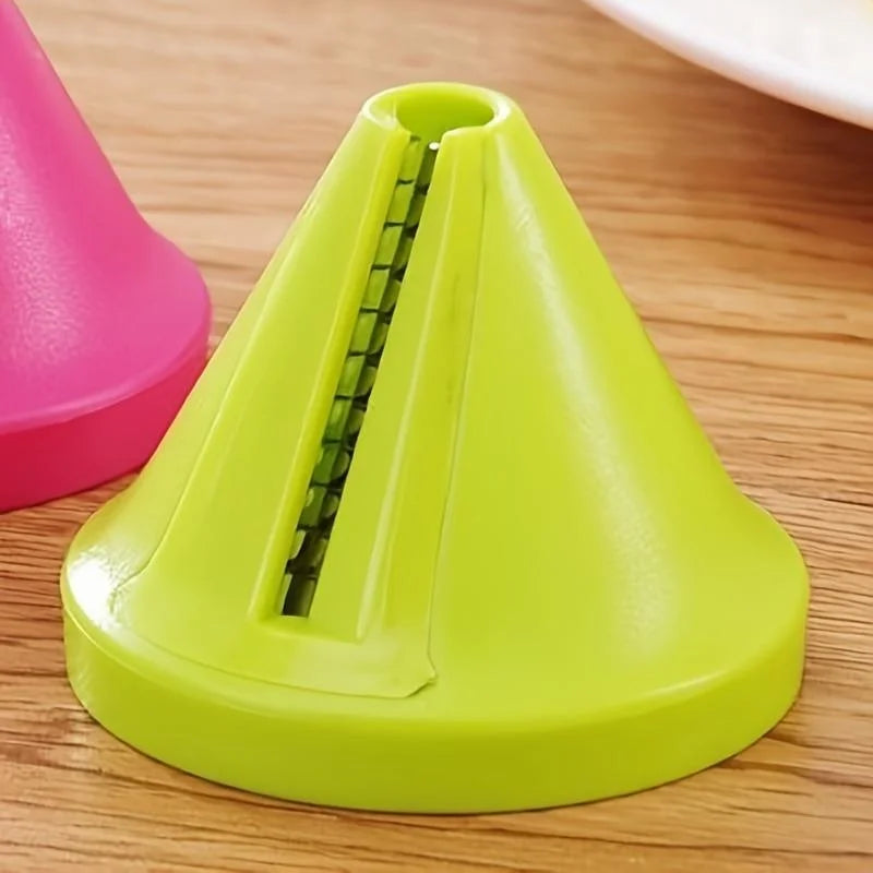 Green plastic cone-shaped object on a wooden surface