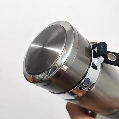 Close-up of a stainless steel thermos with a white background